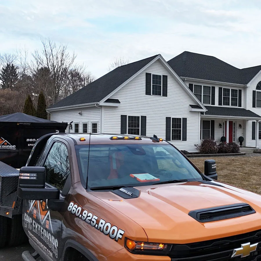 gal7 White two-story home with a truck parked in the driveway