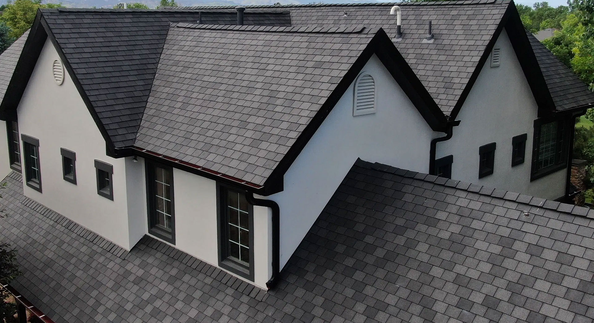 hero-5 Steep gray shingle roof with multiple gables